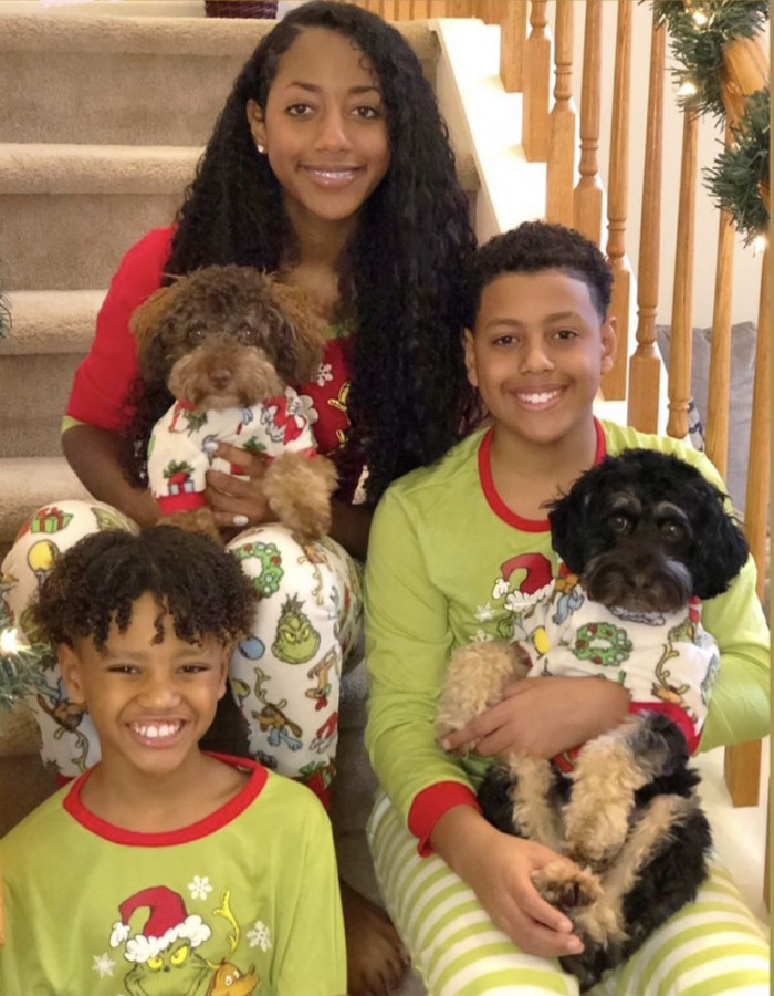 Junior Jadaa Cruz with brothers Dylan (right) and Drew (left), and fur siblings Danny and Dash in festive Christmas PJs