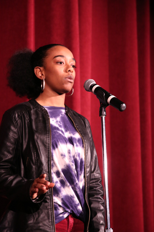 2019s Poetry Out Loud winner Jadia Owens performs in front of the judges and crowd.