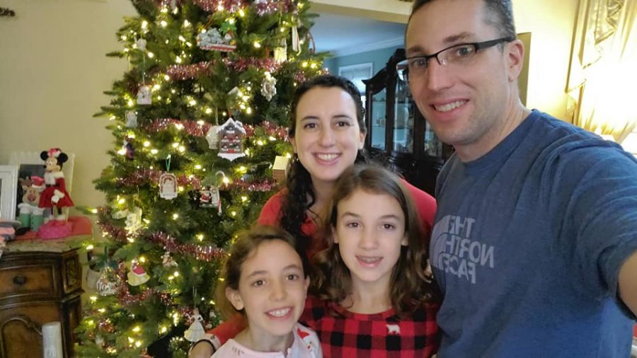 Mrs. Nale with daughters Victoria (left) and Gianna and husband Dan in front of their Christmas tree
