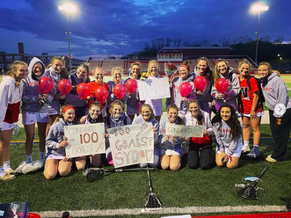 The team celebrates senior Sydney Sventys 100th goal