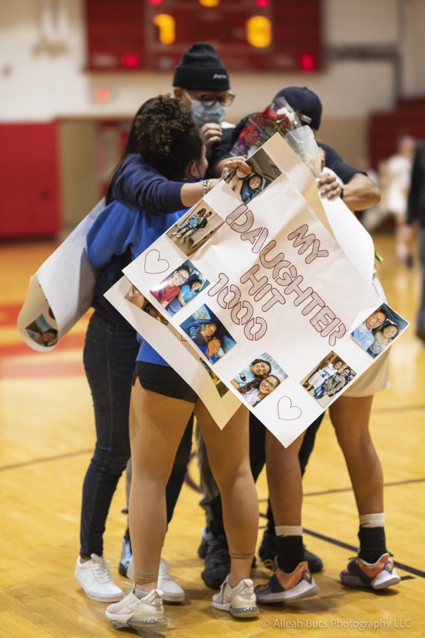 Achieving her 1000 points, Adriana embraces family and celebrates the  well-deserved milestone.