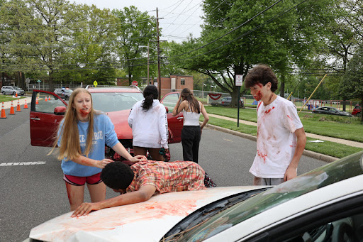 Seniors Maya Martin and Ryan Hans performing in the Mock Crash 