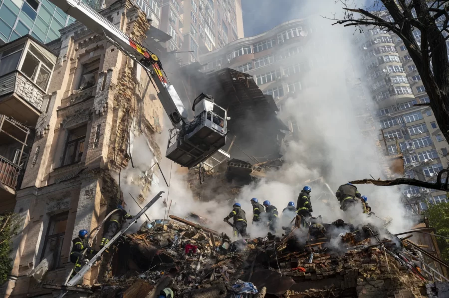 Firefighters work after a drone attack on buildings in Kyiv, Ukraine, on Monday.