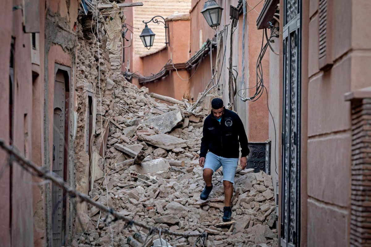 A resident of the historic city of Marrakesh walks through the damage in September
