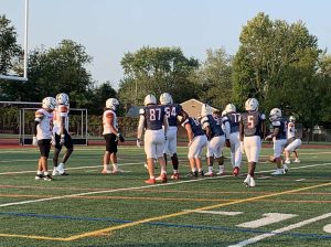 Red Devils line up at the 5-yard line before scoring their first touchdown of the game against Camden Eastside